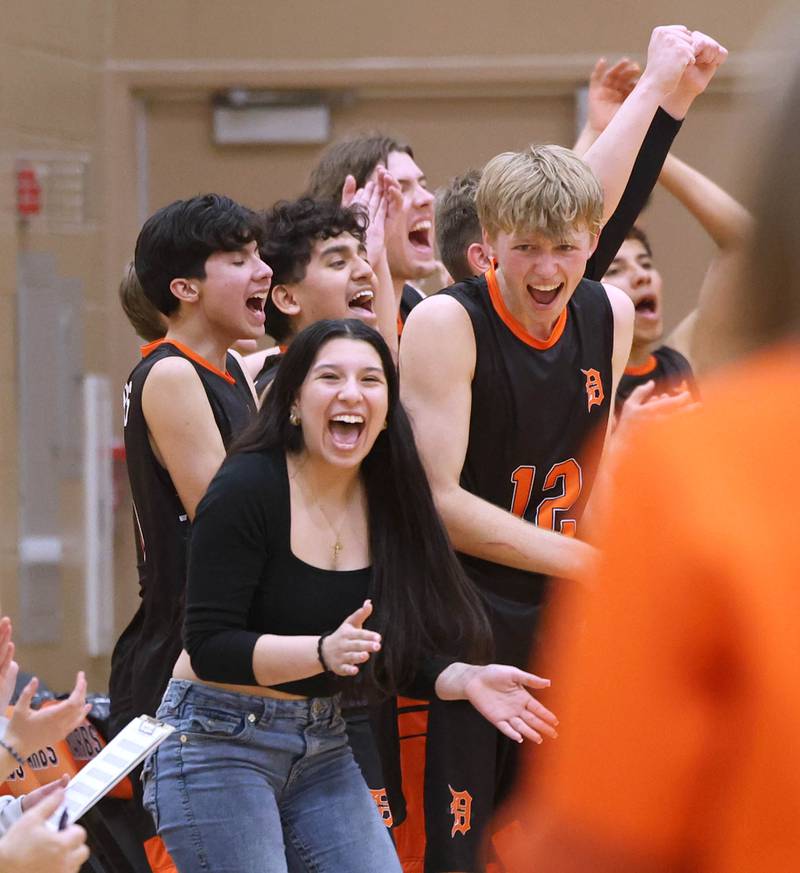 The DeKalb bench celebrates a point Tuesday, April 21, 2026, during their match against Naperville North JV at DeKalb High School.