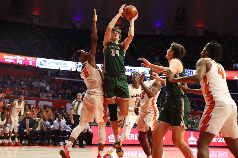 Glenbard West’s Braden Huff goes in for the basket against Whitney Young in the Class 4A championship game at State Farm Center in Champaign. Saturday, Mar. 12, 2022, in Champaign.