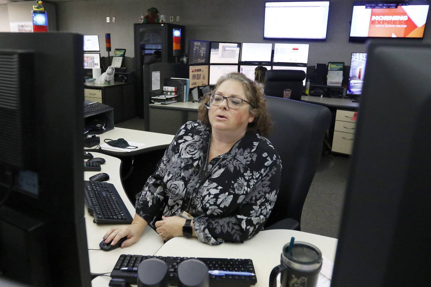 SEECOM telecommunicator Christy Dittmer works the phones and computer systems that connect 911 calls to first responders on Wednesday, Dec. 22, 2021, at Aaron T. Shepley City Hall in Crystal Lake.