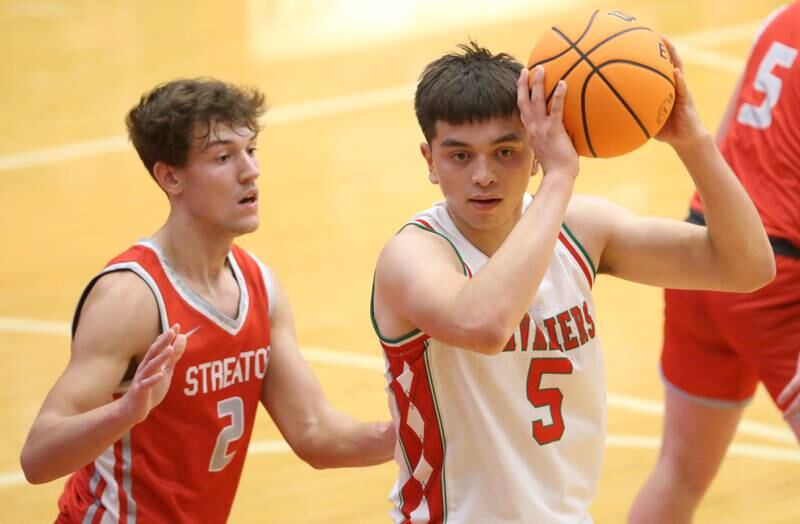 L-P's Erick Sotelo looks to pass the ball off as Streator's Matt Williamson defends during the Dean Riley Shootin' The Rock Thanksgiving Tournament on Monday, Nov. 25, 2024 in Kingman Gym at Ottawa High School.