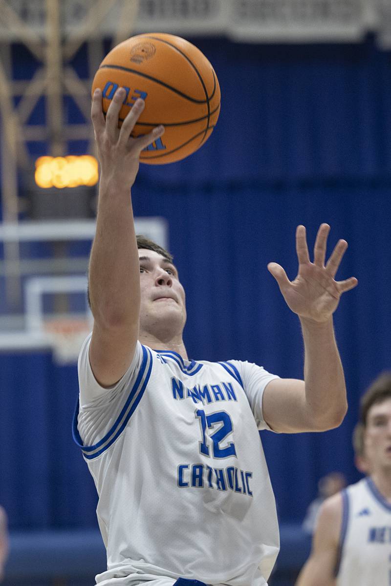 Newman’s Evan Bushman puts in two against Hall Tuesday, Feb. 17, 2026.