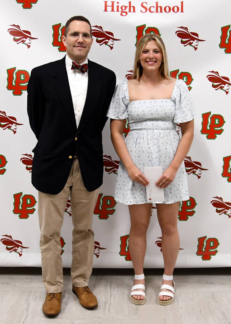 Laurel Politsch (right) received the Esther Styma Scholarship from Philip Slevin (left) of Hometown National Bank. The $1,000 scholarship is awarded to a student with a 3.0 or higher GPA who is a resident of La Salle and submits an essay.