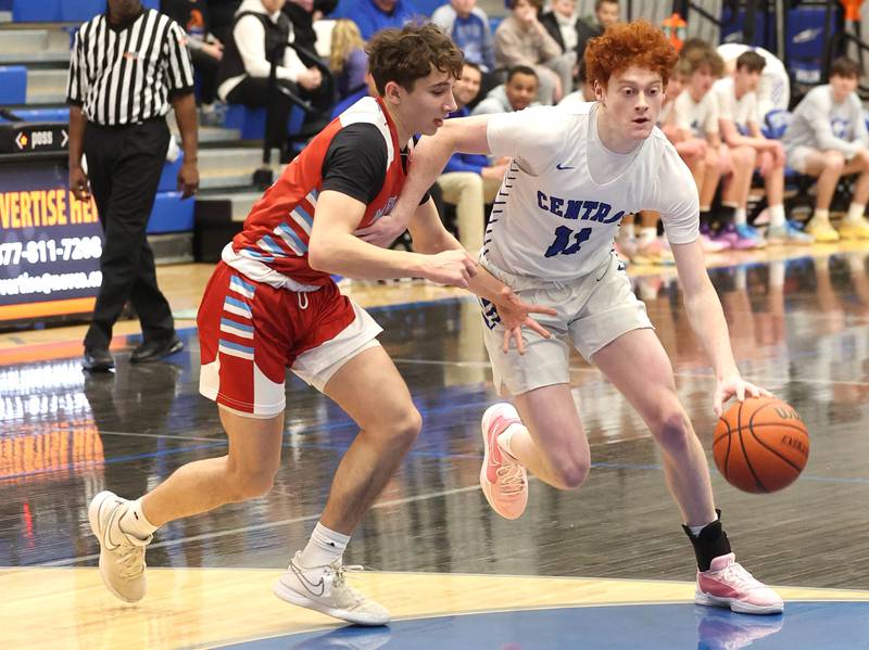 Burlington Central's Patrick Shell drives by Marian Central's Andrew Dovidio Monday, Jan. 15, 2023, during their game in the Burlington Central Martin Luther King Jr. boys basketball tournament.