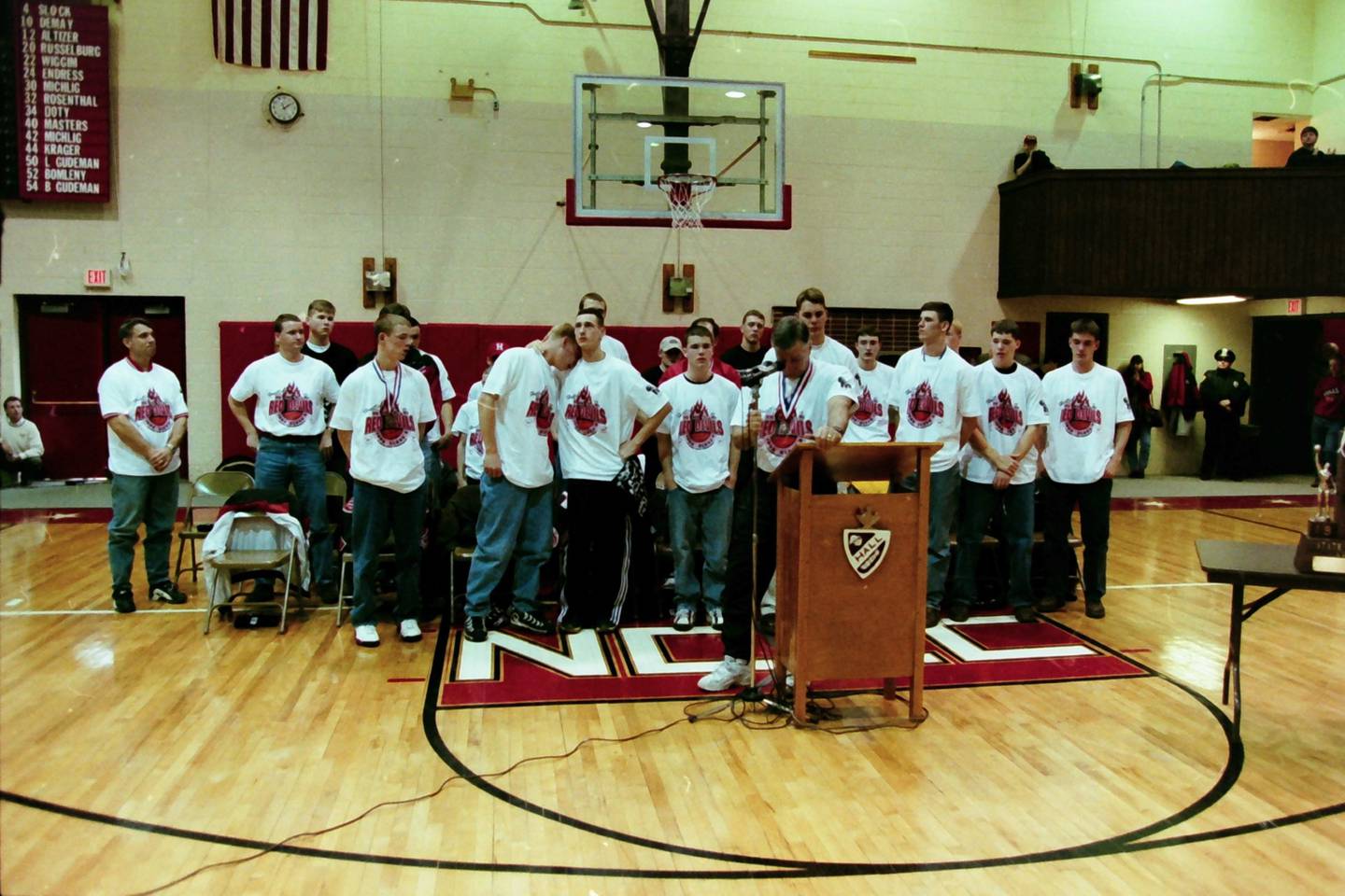 Hall coach Eric Bryant becomes emotional as he talks about his 1997-98 Red Devils basketball team during the welcome home reception at Red Devils Gymnasium.