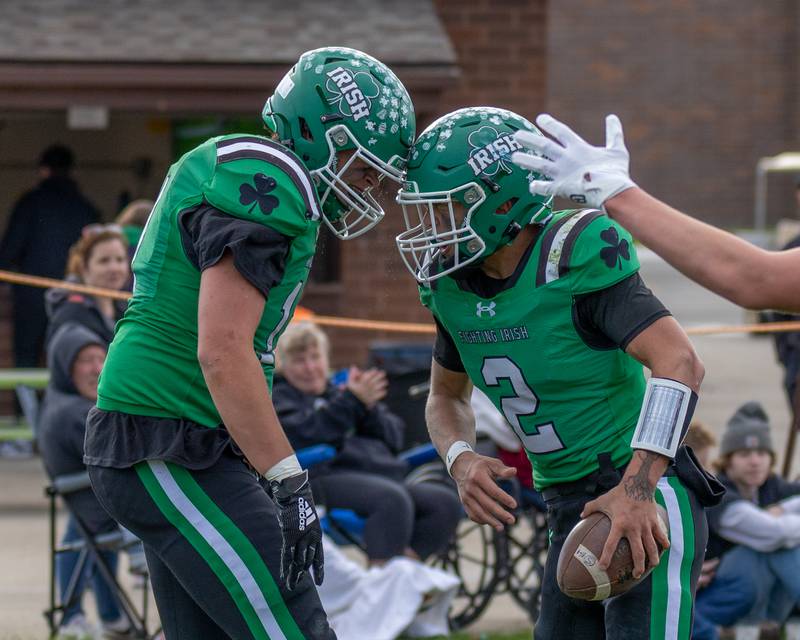(from left) Zebadiah Maxwell (11) of Seneca butts heads in celebration teammate Gunnar Varland's (2) touchdown on Saturday, November 1, 2025 at Seneca High School in Seneca.
