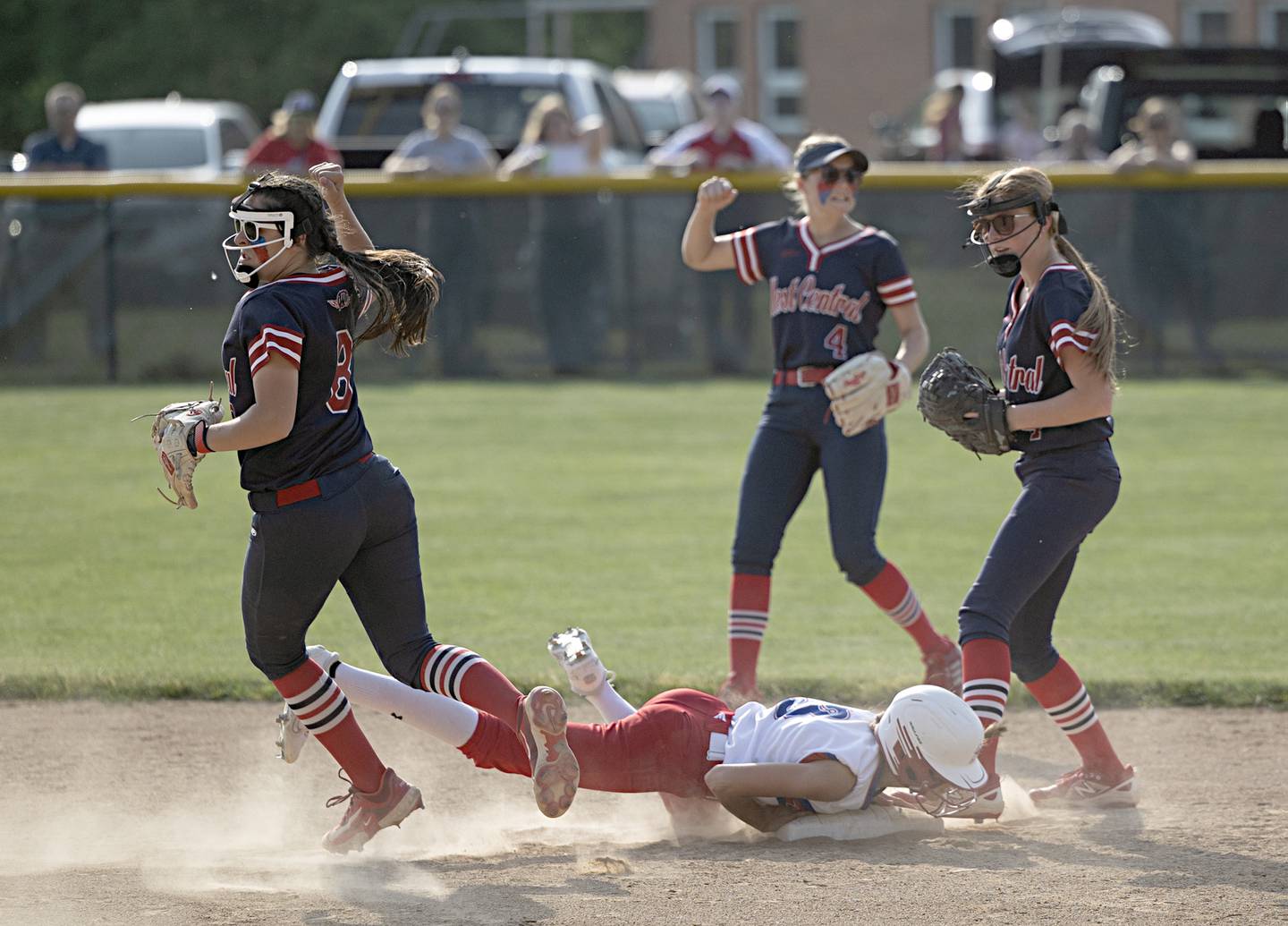 The West Central defense celebrates a double play against Morrison on Wednesday, May 24, 2023 during their Class 1A sectional semifinal at St. Bede Academy.
