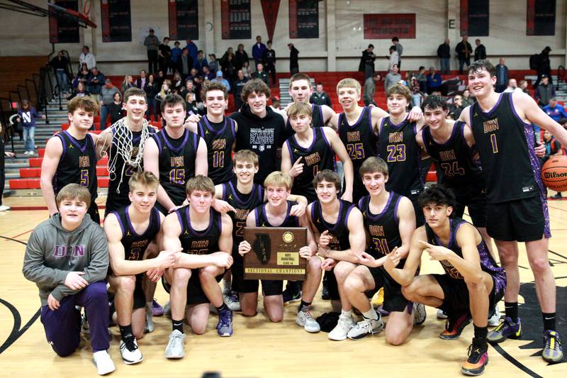 Downers Grove players celebrate their win over Bolingbrook in the Class 4A East Aurora Boys Basketball Sectional final on Friday, March 1, 2024.