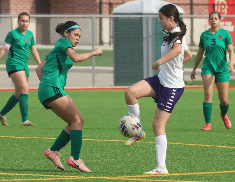 Rochelle's Anaya Ortiz stops the ball in front of L-P's Sofia Nanez  on Wednesday, April 15, 2026 at the L-P Athletic Complex in La Salle.