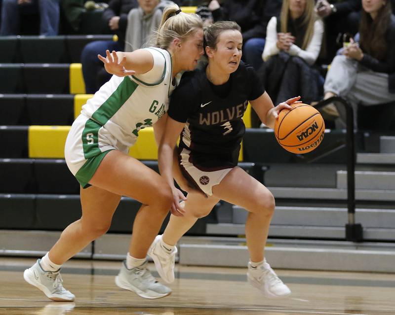 Crystal Lake South's Laken Lepage guards Prairie Ridge's Zoe Nanos as she brings the ball up the court during a Fox Valley Conference girls basketball game on Friday, Dec. 13, 2024, at Crystal Lake South High School.