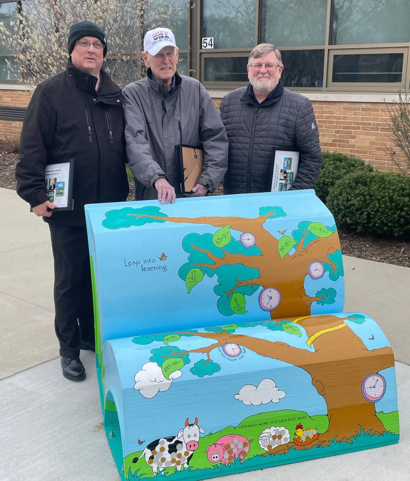 Pictured are Helen’s sons, Ed, far left, and Jim, far right, along with her husband Ed, center.