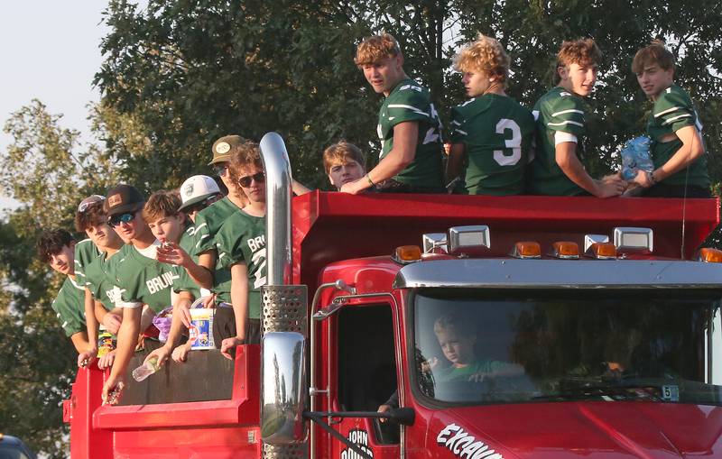 Members of the St. Bede football team ride in the St. Bede Homecoming Parade on Friday, Sept. 29, 2023 at St. Bede Lane.