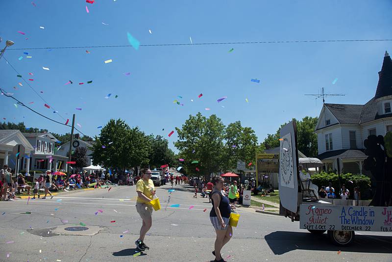 Colorful paper floats though the air Sunday, July 3, 2022, fired from the float of the Polo Area Community Theater.