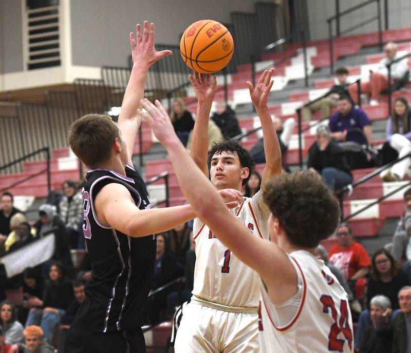 Oregon's Benny Olalde (1) shoots a three-pointer over a Rockford Lutheran defender during a Big Northern Conference game on Friday, Feb. 6, 2026 at the Blackhawk Center in Oregon.