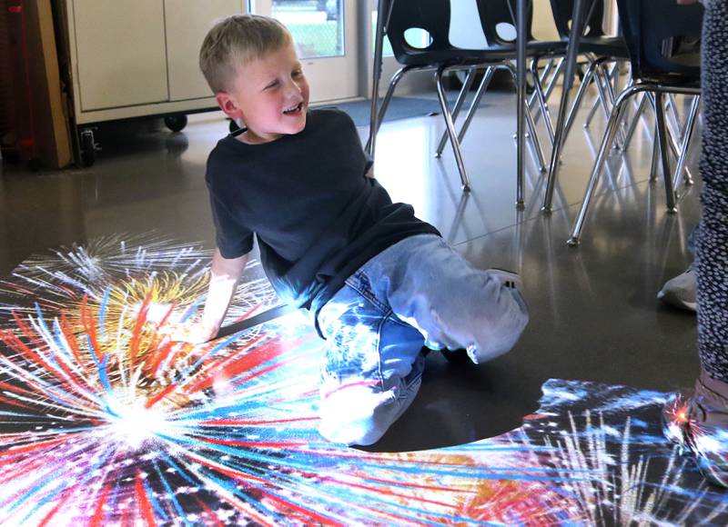 Jack Sanderson, 6, from Kirkland, has some fun with an interactive projected image Wednesday, Nov. 6, 2024, during a grand opening of the Kishwaukee Special Recreation Association’s Sensory Room at the Sycamore Park District Community Center.