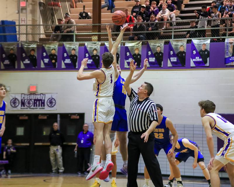 Downers Grove North's Jake Riemer (1) tips off against Lyon's Graham Smith (15) during varsity basketball game between Lyons at Downers Grove North.  Jan 31, 2023.