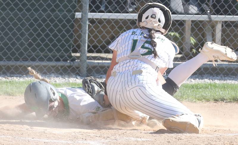 Seneca's Sam Vandevelde scores a run as the ball gets away from St. Bede Bella Pinter on Tuesday, May 7, 2024 at St. Bede Academy.