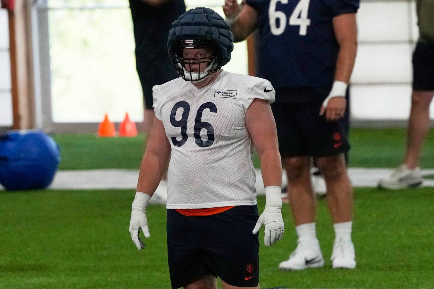 Chicago Bears' Jordan van den Berg warms up with teammates during the NFL football team's rookie minicamp, Friday, May 8, 2026, in Lake Forest, Ill. (AP Photo/Nam Y. Huh)