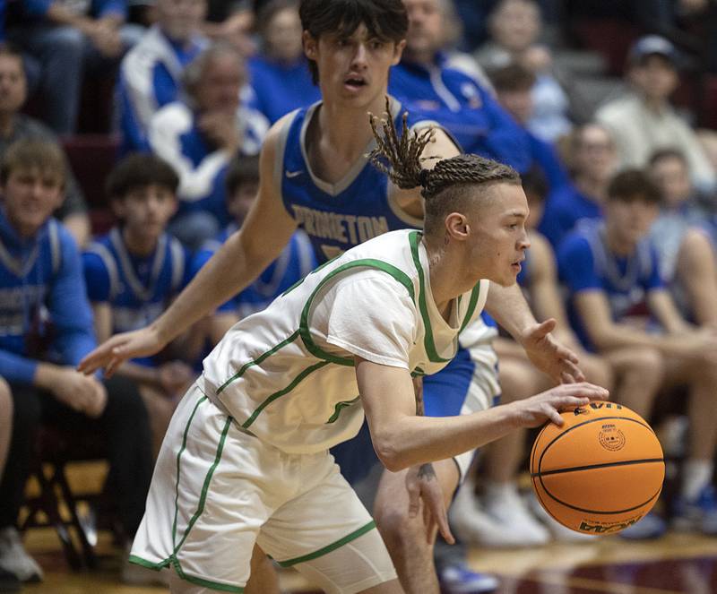 Rock Falls’ Nehemiah Menendez handles the ball against Princeton Friday, March 7, 2025, in the Class 2A boys basketball Sectional final in Marengo.