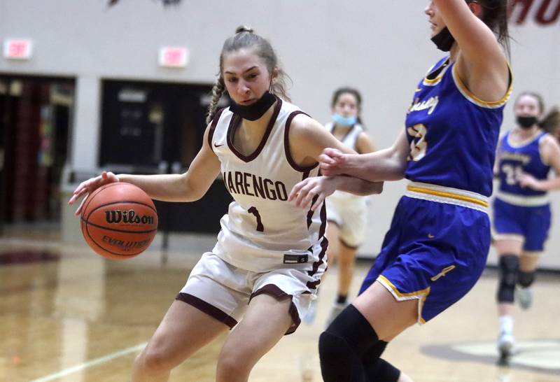 Marengo’s Emily Kirchhoff moves the ball against Johnsburg during girls varsity basketball action in Marengo Thursday night.