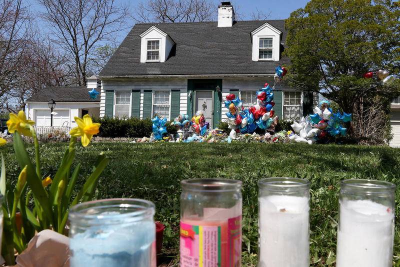 Balloons, stuffed animals, and candles are some of the items left on the front yard to remember the life of Andrew (AJ) Freund at 94 Dole Ave on Friday, April 26, 2019 in Crystal Lake.