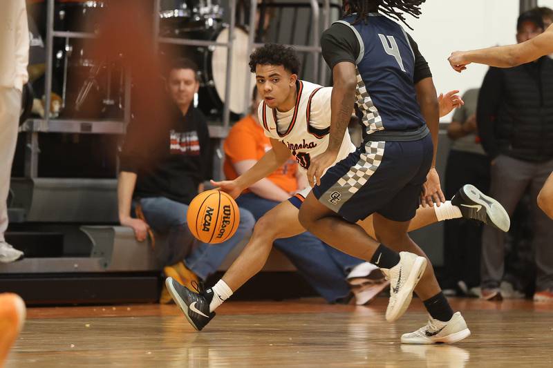 Minooka’s Luke Page works the ball up court against Oswego East on Friday, Jan. 16, 2026 in Minooka.