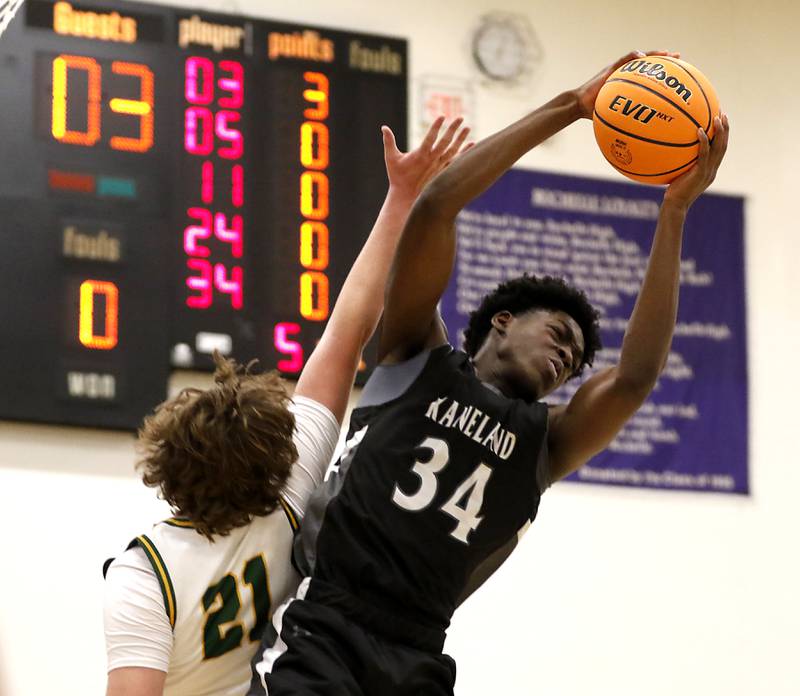 Kaneland's Jeffrey Hassan grabs rebound over Crystal Lake South's Ryan Morgan during the IHSA Class 3A Rochelle Sectional championship basketball game on Friday, March 7, 2025, at Rochelle High School.
