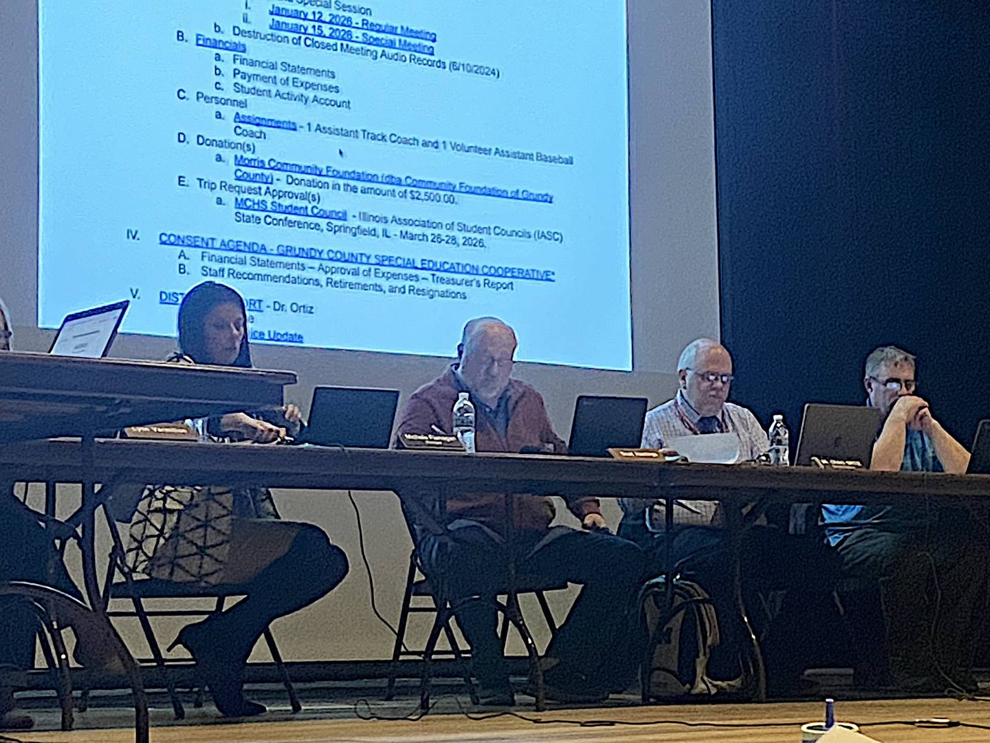 From left, Morris principal Michelle Flanagan, school board president Scot Hastings, superintendent Dr. Craig Ortiz and board member Chris Danek listen during Monday's meeting.