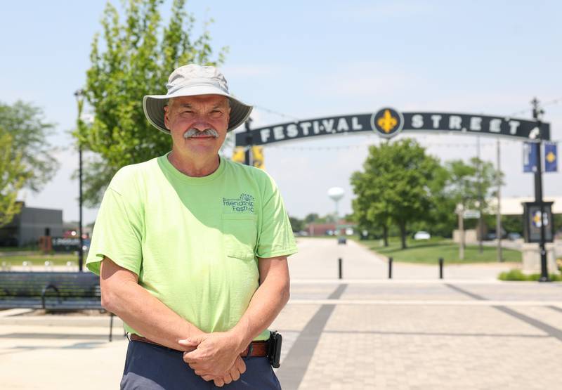 Bob Steinke, longtime chairperson of the Bourbonnais Friendship Festival, poses for a photo on Festival Street at The Grove where the 50th annual festival will be held later this month. Steinke, who has been involved with the festival since 1999, has stewarded the five-day celebration through the decades as his five children, and now 12 grandchildren, have joined him in volunteer roles and annual attendance.