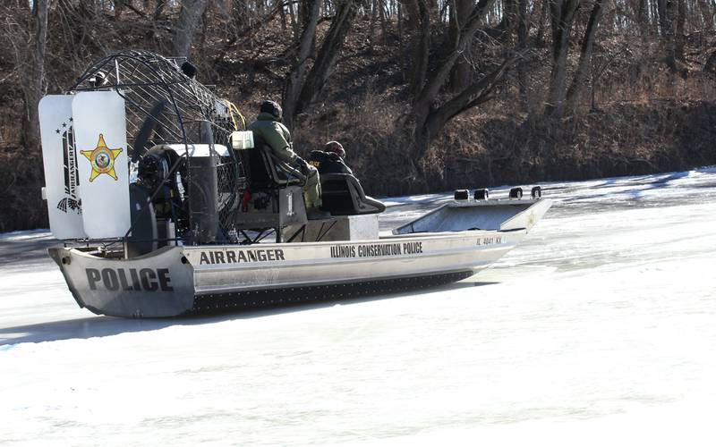Conservation Police officers glide on top of ice during a training mission on Monday, Jan. 27, 2025 along the Fox River in Ottawa.
