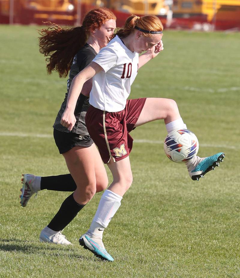 Morris' Danica Martin  tries to kick the ball away from Sycamore's Izzie Segreti during their Interstate 8 Conference Tournament semifinal game Wednesday, May 3, 2023, at Sycamore High School.