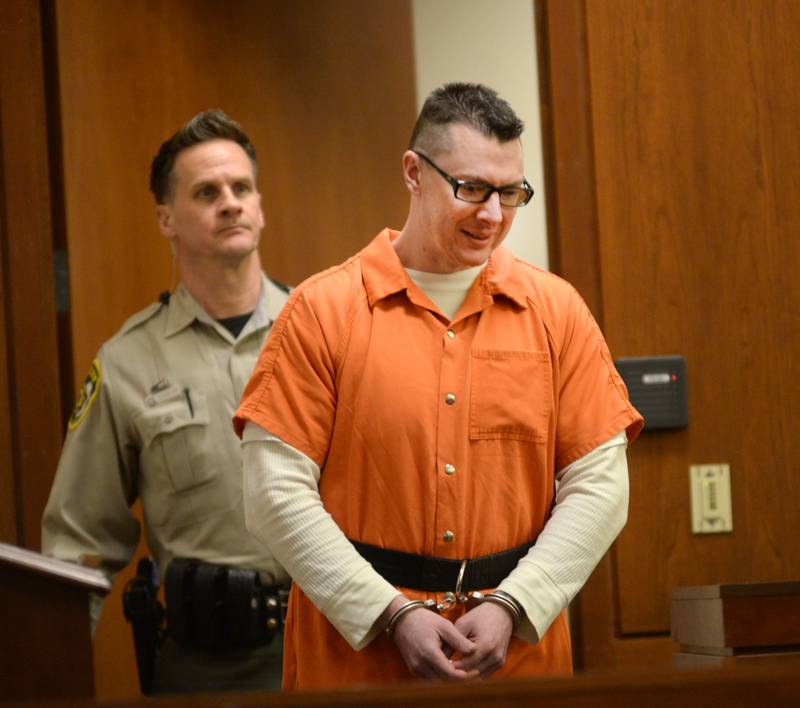 Duane Meyer, 42, is escorted into a courtroom at the Ogle County Judicial Center by Deputy Dan Daub on Thursday. Dec. 12, 2024.