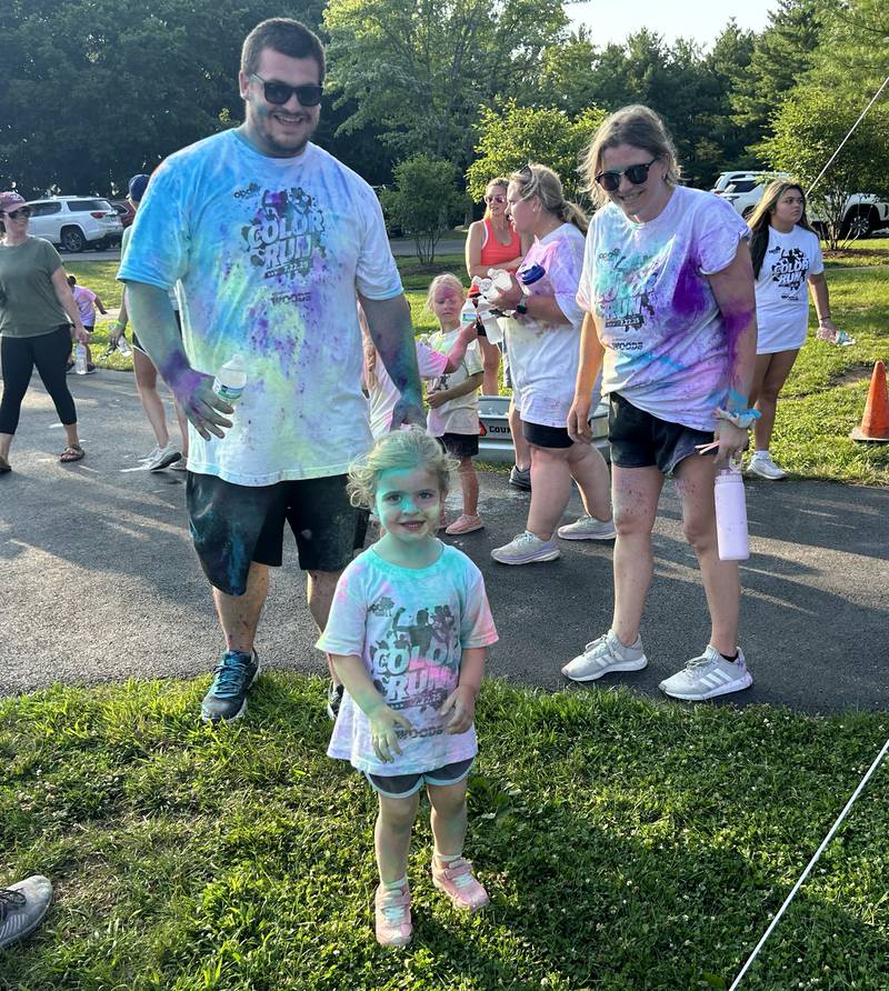Tatum Blume of Oregon led her mom and dad, Tyler and Jordan, through the Oregon Park District's Color Run on Tuesday, July 22, 2025 at Oregon Park West.