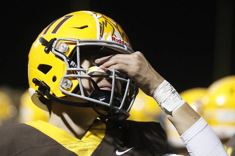 Jacobs' Max Benner tries to gathers his emotions in the final minutes of Jacobs lost to Brother Rice in a IHSA Class 7A first round playoff football game Friday, Oct. 28, 2022, at Jacobs High School in Algonquin.