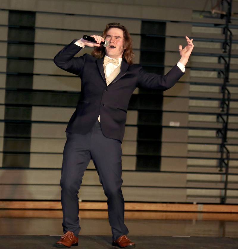 Finn Gannon sings “New York, New York” during the Mr. Kaneland 2023 competition on Friday, March 10, 2023 in Maple Park.