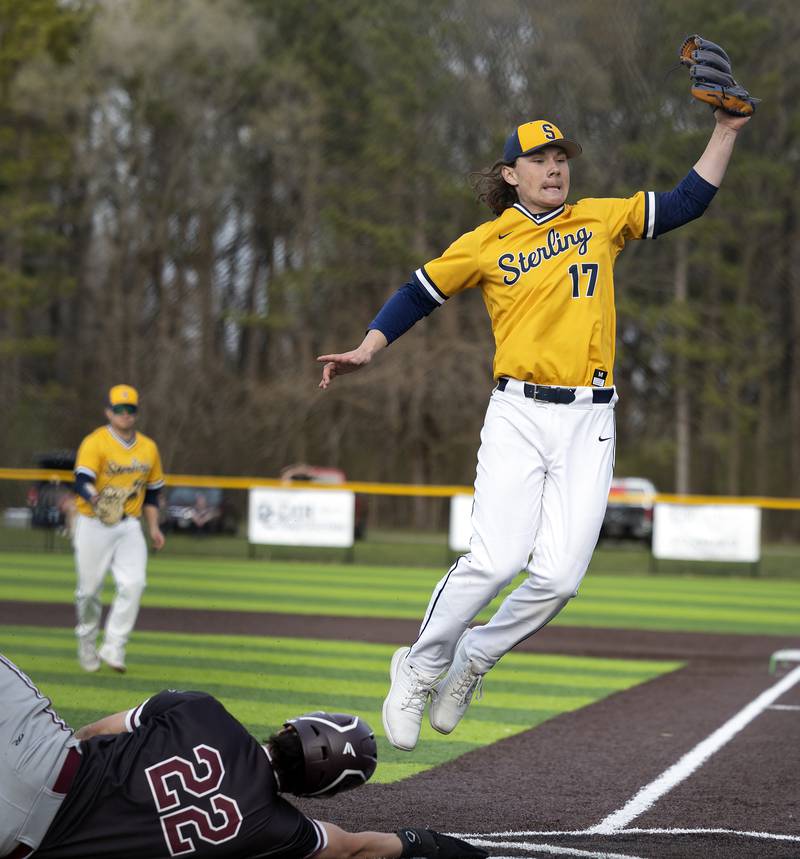 Sterling’s Eli Penne covers home after a passed ball against Moline Wednesday, April 16, 2025.