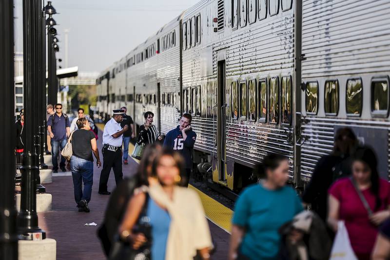 Passengers walk along the new Metra Rock Island District platform after arriving downtown on a train Friday, Sept. 26, 2014. Metra and Amtrak trains will no longer be arriving at Joliet's Union Station as construction of the new Joliet Gateway Center continues.