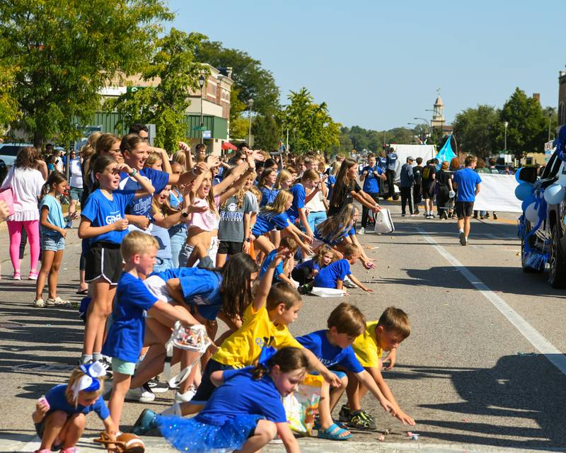 Youth of all ages go after candy during the Geneva High School Homecoming Parade on Friday, Sept. 26, 2025, along State Street in downtown Geneva.