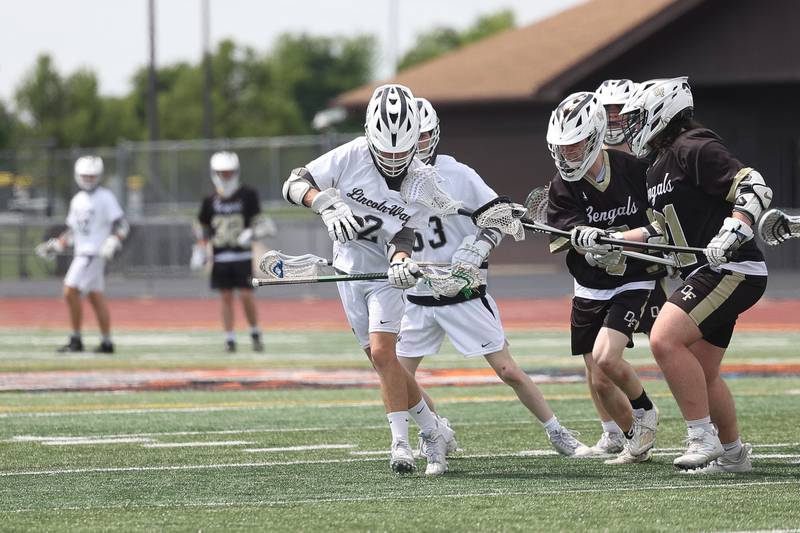 Lincoln-Way’s Tommy Otrembiak emerges from the group with the loose ball against Oak Forest on Saturday, May 4, 2024 at Lincoln-Way West in New Lenox.