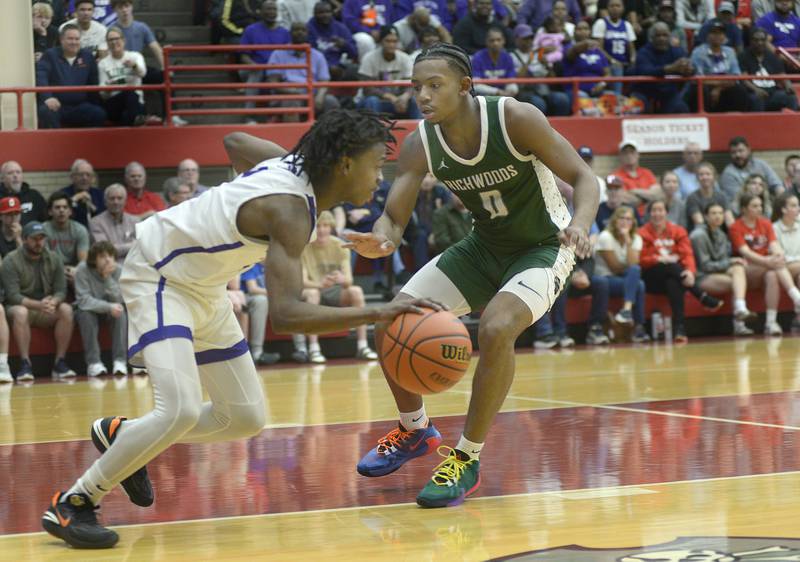 Thorton’s Chase Abraham drives past Peoria Richwood’s Daquan Little Monday in the 1st Period during the Super Sectional game at Ottawa.