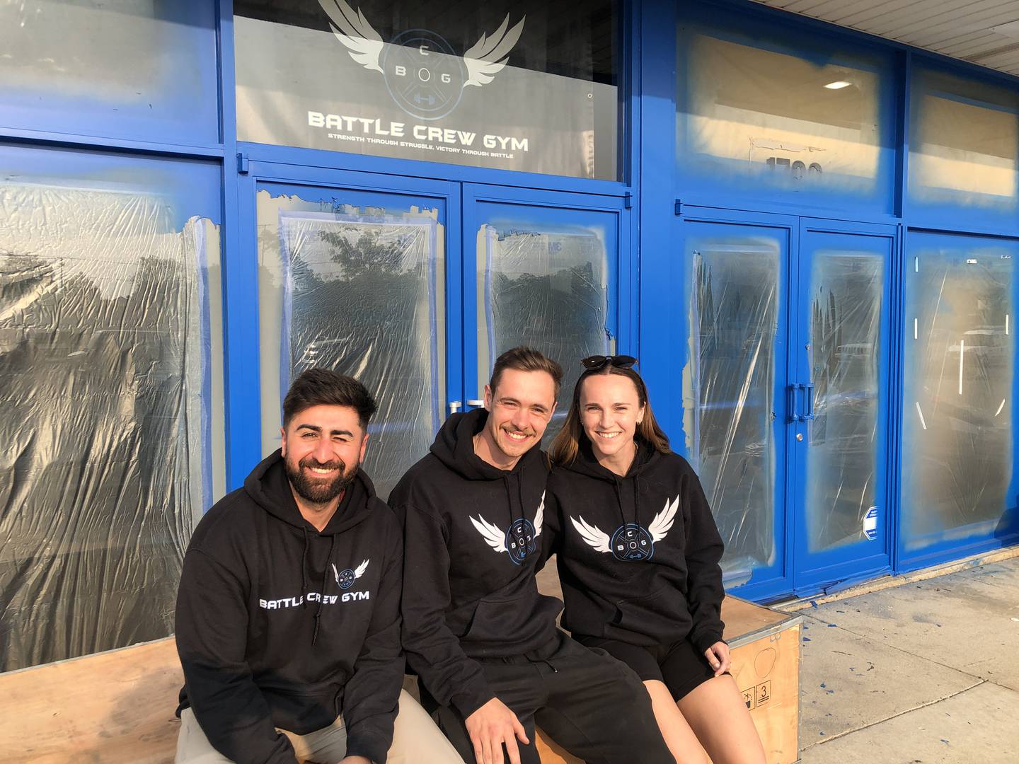 Jonathan Yousif, left, and Jared Schnulle, are working to open Battle Crew Gym, 1792 N. Richmond Road, McHenry. The independent gym is set to open Saturday, June 21, 2025. At right is Schnulle's wife Olivia Schnulle, who is helping with marketing.