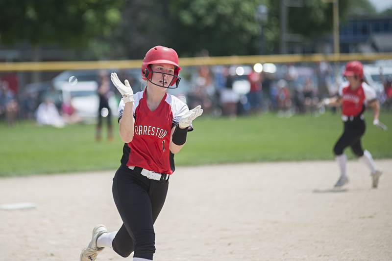 Forreston’s Rylee Broshous celebrates teammate Brooke Boettner’s two run homer to tie the game in the seventh against West Central Monday, May 30, 2022.