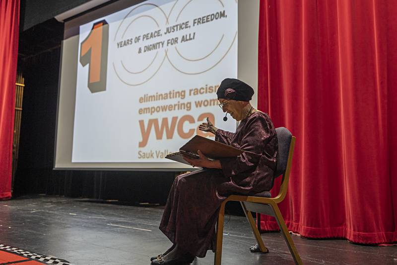 Peg Williams, channeling Lila Stevens an original member of the Sauk Valley YWCA, introduces a movie Friday, Jan. 19, 2024 recognizing the organization’s 100th anniversary during a celebration at Sauk Valley College.