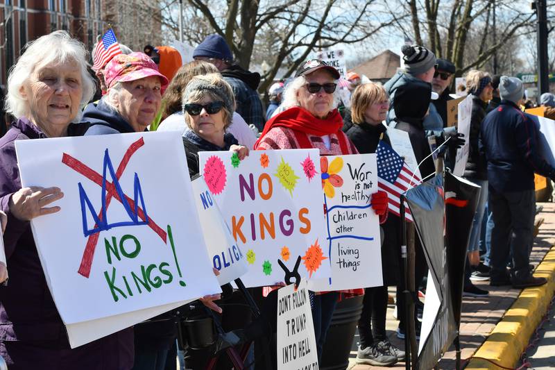 People line the sidewalk along state Route 2 in downtown Oregon, Illinois, during the No Kings rally organized by Indivisible of Ogle County on Saturday, March 28, 2026. The 2-hour afternoon event drew an estimated crowd of 650 who stood on the sidewalks of the Ogle County Courthouse.