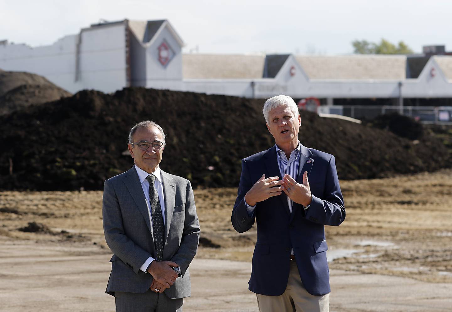 Tim Grogan of Heartland Real Estate Partners, (left) and Crystal Lake Mayor Haig Haleblian talk during a groundbreaking event for the Water’s Edge development on Wednesday, Oct. 18, 2023. The development will include new commercial buildings, townhomes and apartments.