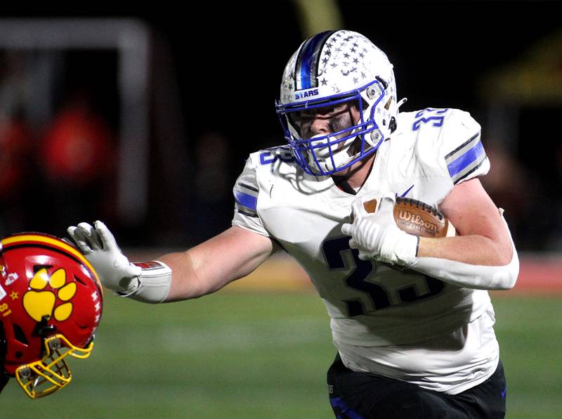 St. Charles North’s Jake Furtney (33) blocks Batavia’s Joey Barbush (81) in the first quarter during a game at Batavia on Friday, Oct. 21, 2022.