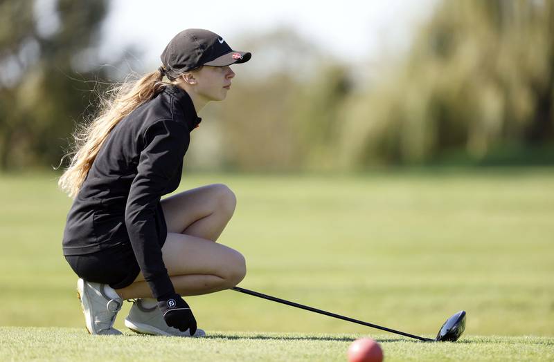 Claire Snider of Wheaton Warrenville South, watches her drive during the IHSA Class 2A West Chicago girls golf regional at St. Andrews Tuesday, Oct. 1, 2024 in West Chicago.