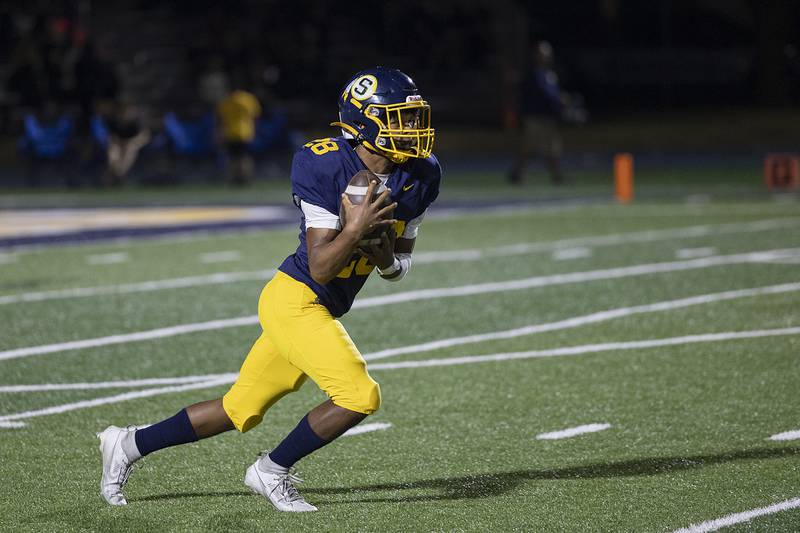 Sterling’s Marice De La Cruz takes a punt against Quincy Friday, Oct. 17, 2025.