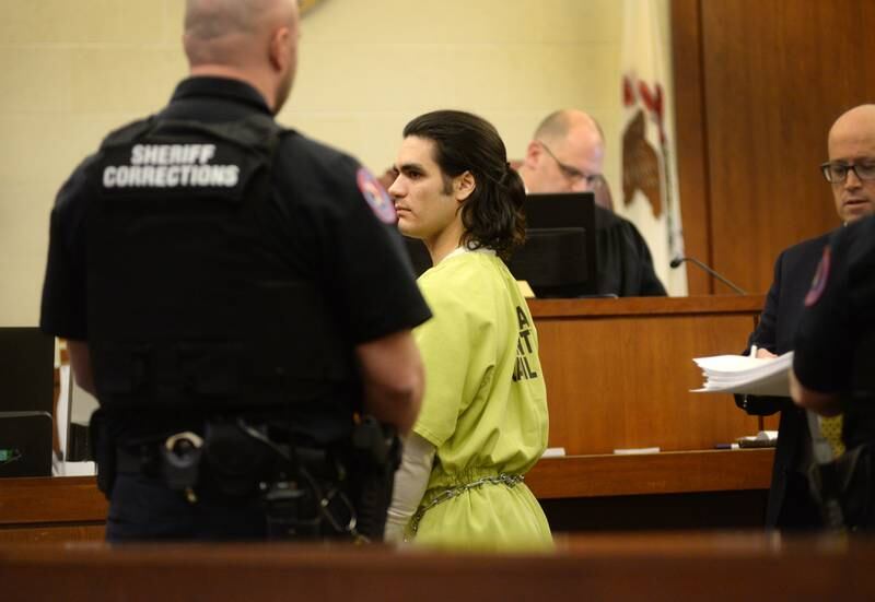 Jonathon Gounaris (center) is escorted out of a courtroom at the Ogle County Judicial Center in Oregon on Thursday, Dec. 19, 2024. He is charged with four counts of attempted first-degree murder following a June incident at his rural home where three police officers were shot. He has pleaded not guilty to the charges and is being held in the Winnebago County Jail as his case proceeds through the court system.