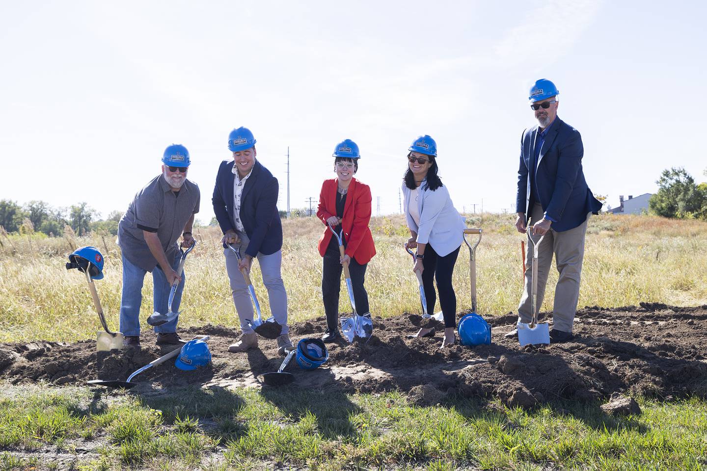 City aldermen Jim Wise (left), Joe Strabala-Bright, and Kaitlyn Ekquist break ground with mayor Diane Merdian and city manager Scott Shumard Tuesday, October. 1, 2024, for the riverfront project along Wallace Street.