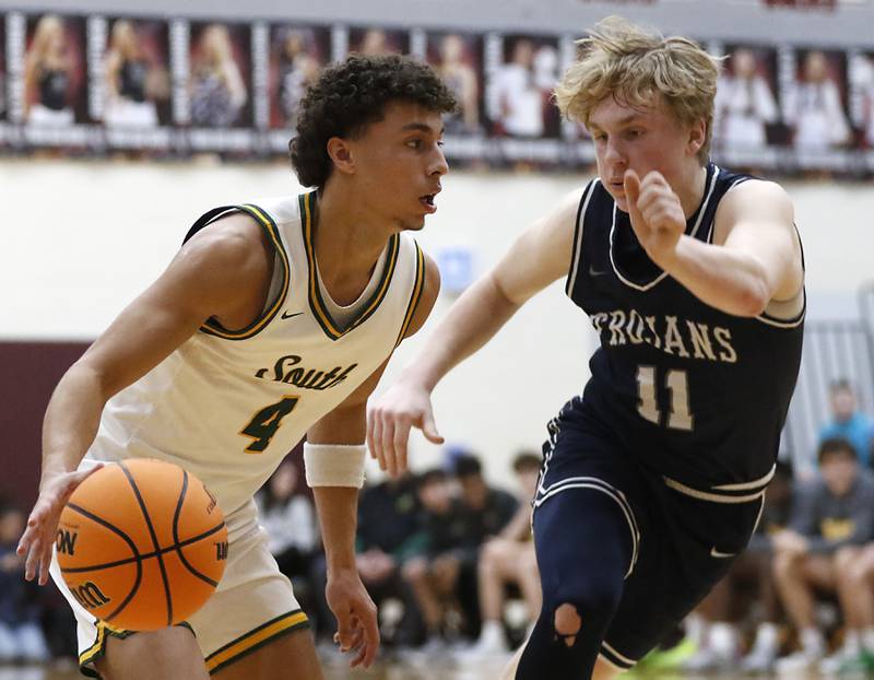 Crystal Lake South's Anthony Demirov pushes the ball up the court against Cary-Grove's Landon Nawracaj during the IHSA Class 3A Prairie Ridge Regional championship basketball game on Friday, Feb. 28, 2025, at Prairie Ridge High School in Crystal Lake.